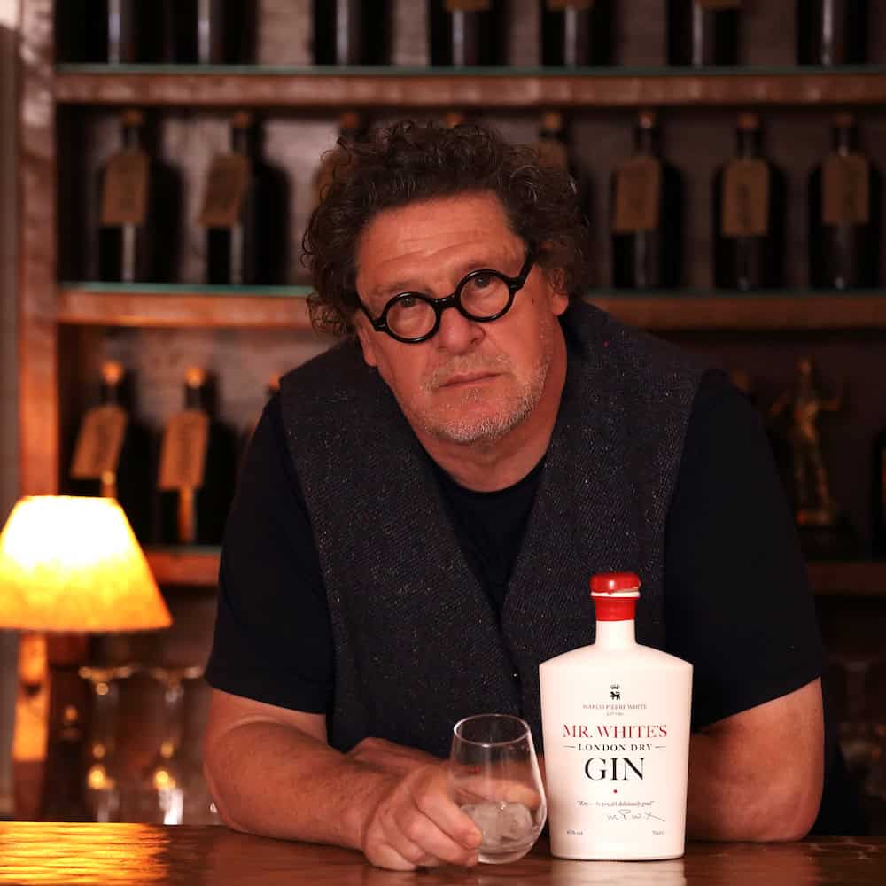 Marco Pierre White holding a glass of Mr White’s London Dry Gin